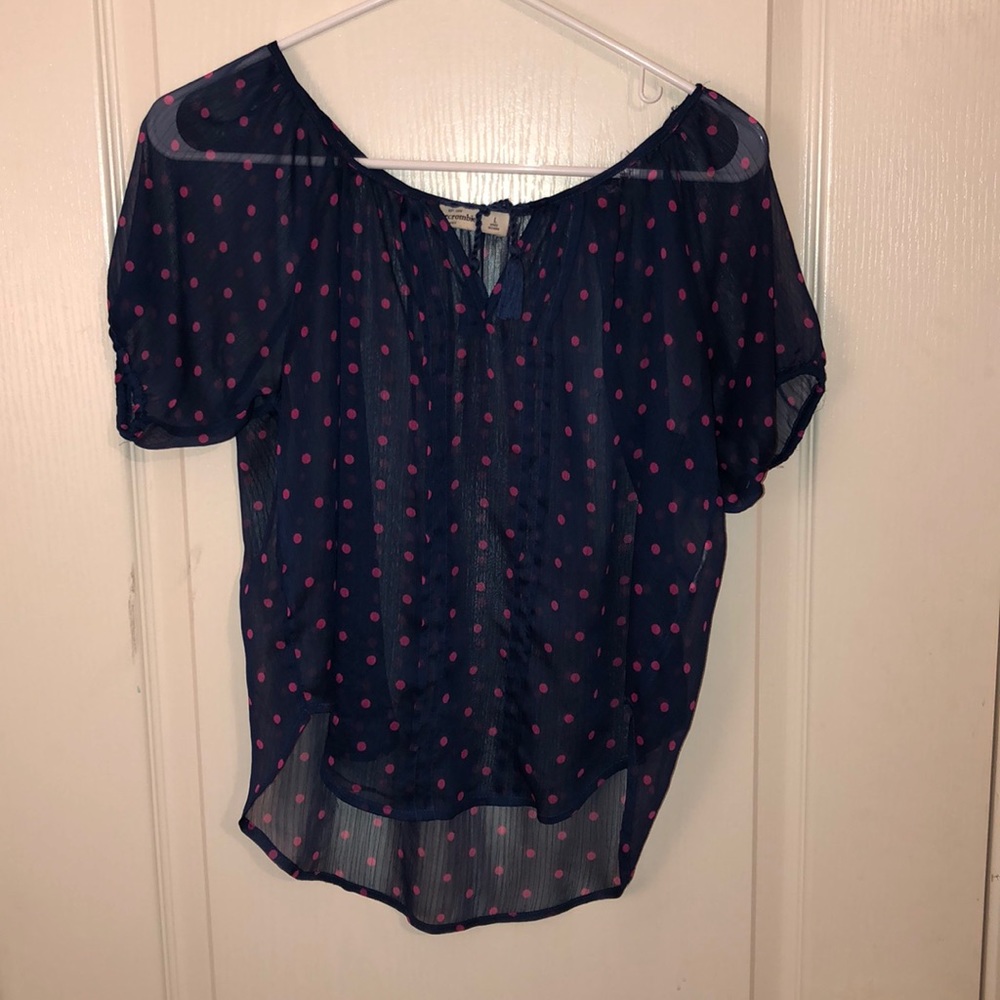 sheer navy blouse with hot pink polka dots.